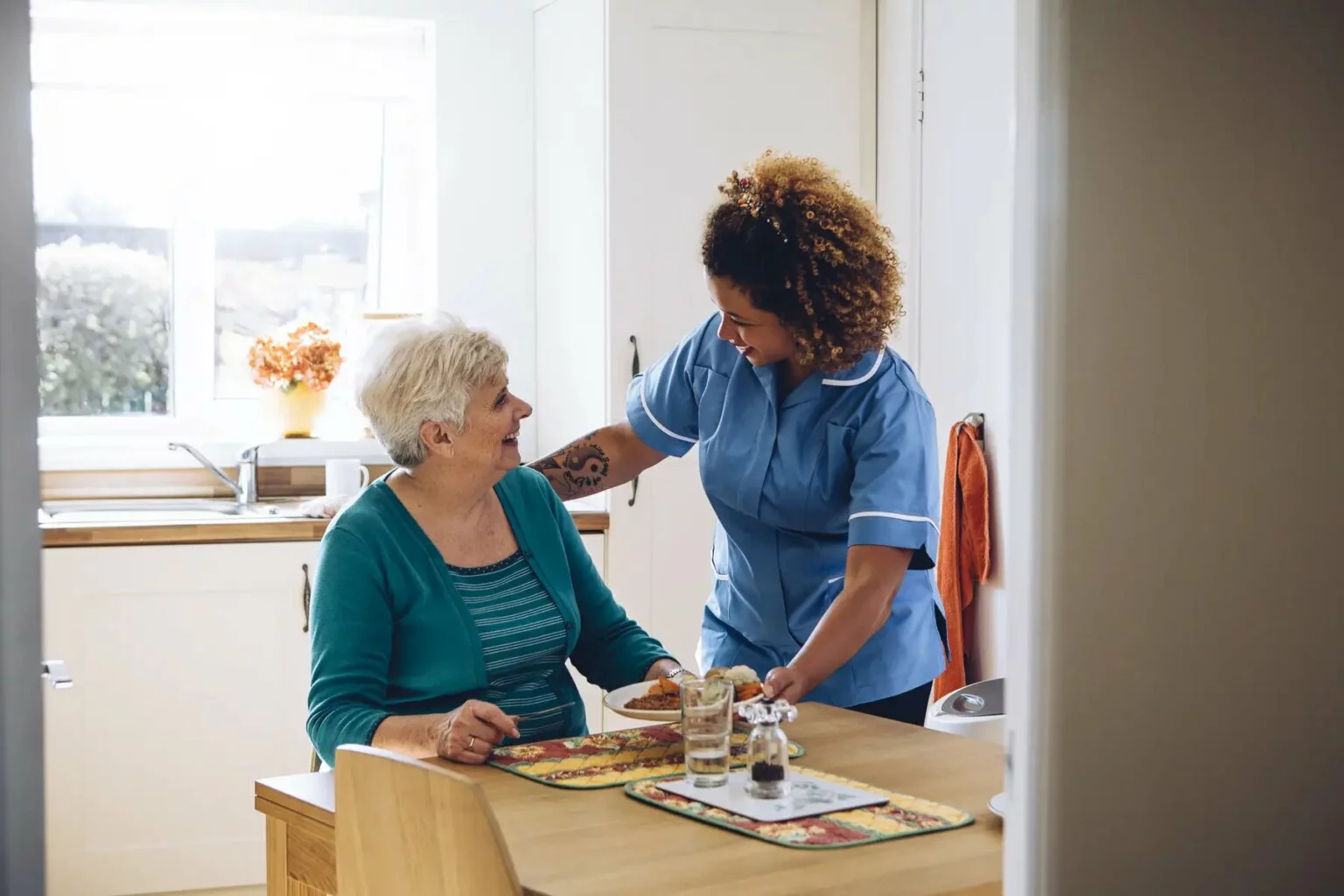 A USP carer sharing a warm moment with a client in their home